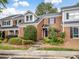 Charming brick townhome with well-maintained landscaping and a welcoming entrance at 9121 Kings Canyon Dr, Charlotte, NC 28210