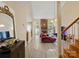Open-concept living room featuring a brick fireplace and wood-look flooring at 9121 Kings Canyon Dr, Charlotte, NC 28210