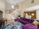 Open-concept living space with a view of the kitchen, stairs, and vaulted ceilings at 9121 Kings Canyon Dr, Charlotte, NC 28210