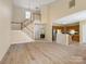 Spacious open floor plan with combined living and kitchen areas, and staircase at 9121 Kings Canyon Dr, Charlotte, NC 28210
