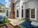 Inviting patio area with a brick chimney, offering outdoor entertaining possibilities at 9121 Kings Canyon Dr, Charlotte, NC 28210