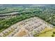 Aerial view showcasing a neighborhood surrounded by lush greenery at 915 Claires Creek Ln, Davidson, NC 28036