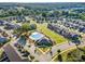 A scenic aerial view of the community pool and clubhouse surrounded by homes and landscaped grounds at 915 Claires Creek Ln, Davidson, NC 28036