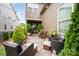 Cozy backyard featuring a patio with furniture, potted plants, and string lights at 915 Claires Creek Ln, Davidson, NC 28036