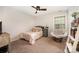 Cozy bedroom with a comfortable bed, a soft chair, and plenty of natural light at 915 Claires Creek Ln, Davidson, NC 28036