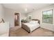 Comfortable bedroom featuring a neutral color scheme, comfortable bed and plenty of sunlight at 915 Claires Creek Ln, Davidson, NC 28036