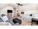 Spacious bedroom featuring an office nook, a comfortable bed and couch, and lots of sunlight at 915 Claires Creek Ln, Davidson, NC 28036