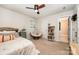Comfortable bedroom featuring a ceiling fan, stylish chair, and built-in storage at 915 Claires Creek Ln, Davidson, NC 28036