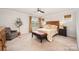 Comfortable bedroom featuring a queen size bed with decorative pillows, and a ceiling fan at 915 Claires Creek Ln, Davidson, NC 28036