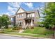 Charming two-story home with landscaped yard and inviting front porch at 915 Claires Creek Ln, Davidson, NC 28036