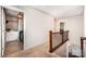 Hallway leading to the laundry room, featuring upper cabinets for storage and full size appliances at 915 Claires Creek Ln, Davidson, NC 28036