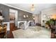 Bright living room featuring a decorative chandelier, two arm chairs and decorative pictures at 915 Claires Creek Ln, Davidson, NC 28036