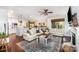 Open-concept living room with hardwood floors and abundant natural light at 915 Claires Creek Ln, Davidson, NC 28036