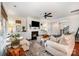 Cozy living room with fireplace, neutral decor, and ample seating at 915 Claires Creek Ln, Davidson, NC 28036