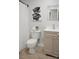 Clean bathroom with a white toilet, vanity with storage, and a shower with a white curtain at 918 Creekridge Dr, Monroe, NC 28110