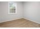 Bright bedroom featuring a large window and modern flooring for comfortable living at 918 Creekridge Dr, Monroe, NC 28110