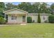 Charming single-story home with a well-manicured lawn and welcoming front porch at 918 Creekridge Dr, Monroe, NC 28110