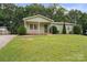 Charming single-story home with a well-manicured lawn and inviting front entrance at 918 Creekridge Dr, Monroe, NC 28110