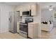 Modern kitchen with stainless steel appliances and neutral-toned cabinetry for a contemporary look at 918 Creekridge Dr, Monroe, NC 28110