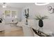 Bright and airy living space with stylish decor and a dining table providing a comfortable area for relaxation at 918 Creekridge Dr, Monroe, NC 28110