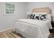 Bedroom with a stylish headboard, decorative pillows, and a neutral color scheme, creating a relaxing atmosphere at 918 Creekridge Dr, Monroe, NC 28110