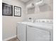 This laundry room features modern appliances and ample storage at 10108 Florentine Way, Charlotte, NC 28214