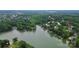 Stunning view of homes near the lake with mature trees providing privacy and shade at 10449 Quiet Bay Ct, Charlotte, NC 28278
