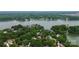 Beautiful view of homes and lake with tree canopy, perfect for nature enthusiasts at 10449 Quiet Bay Ct, Charlotte, NC 28278