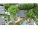 Overhead view of home featuring a well-manicured lawn and landscaping with mature trees at 10449 Quiet Bay Ct, Charlotte, NC 28278