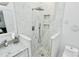 Modern bathroom with rainfall showerhead, tiled walls, and sleek fixtures at 10449 Quiet Bay Ct, Charlotte, NC 28278