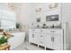 Bright bathroom with a soaking tub, double vanity, and white marble accents at 10449 Quiet Bay Ct, Charlotte, NC 28278