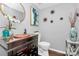 Elegant half bathroom featuring modern fixtures and sophisticated decor at 10449 Quiet Bay Ct, Charlotte, NC 28278