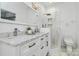 Stylish bathroom featuring marble countertops, decorative lighting, and tiled shower at 10449 Quiet Bay Ct, Charlotte, NC 28278