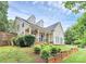 Well-maintained home with stone accents, dormer windows, and a professionally landscaped yard for enhanced curb appeal at 10449 Quiet Bay Ct, Charlotte, NC 28278