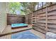 Relaxing hot tub on a wooden deck surrounded by a privacy fence with decor for ultimate comfort at 10449 Quiet Bay Ct, Charlotte, NC 28278