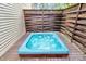 Relaxing hot tub on a wooden deck surrounded by a privacy fence for ultimate comfort at 10449 Quiet Bay Ct, Charlotte, NC 28278