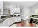 Bright kitchen featuring white cabinetry and ample counter space at 10449 Quiet Bay Ct, Charlotte, NC 28278