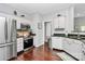 Updated kitchen with stainless steel appliances and granite countertops at 10449 Quiet Bay Ct, Charlotte, NC 28278