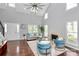 Bright living room offers vaulted ceilings, fireplace, and hardwood floors at 10449 Quiet Bay Ct, Charlotte, NC 28278