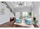 Bright living room boasts tall ceilings, sleek floors, and modern decor at 10449 Quiet Bay Ct, Charlotte, NC 28278