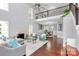 Bright living room with a soaring ceiling, hardwood floors, fireplace, and an open floor plan for entertaining at 10449 Quiet Bay Ct, Charlotte, NC 28278
