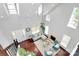 Bright living room featuring soaring ceilings, large windows, and a cozy fireplace at 10449 Quiet Bay Ct, Charlotte, NC 28278