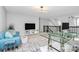 Open loft space featuring a work area, sitting area, and great natural light at 10449 Quiet Bay Ct, Charlotte, NC 28278