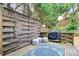 Cozy deck featuring an outdoor kitchen and decorative elements, perfect for relaxation and entertainment at 10449 Quiet Bay Ct, Charlotte, NC 28278