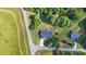 Aerial view of home surrounded by mature trees on an expansive lot near the road at 105 Saddlewood Ln, Statesville, NC 28625