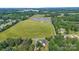 Expansive property featuring a large field, pond, trees and multiple homes at 105 Saddlewood Ln, Statesville, NC 28625