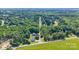 Aerial view showcasing the home amidst a densely wooded neighborhood at 105 Saddlewood Ln, Statesville, NC 28625