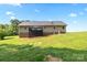 Expansive back exterior view of the house showing the deck and well-maintained yard at 105 Saddlewood Ln, Statesville, NC 28625