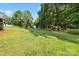 Large backyard features mature trees, an outbuilding, and ample space at 105 Saddlewood Ln, Statesville, NC 28625