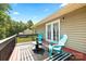 Cozy deck featuring outdoor seating and a peaceful backyard view at 105 Saddlewood Ln, Statesville, NC 28625